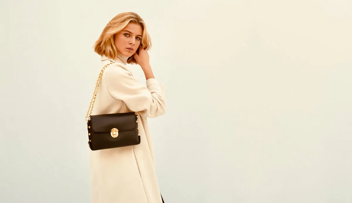 The Bloxsome Black Leather Crossbody Bag With Gold Chain Strap