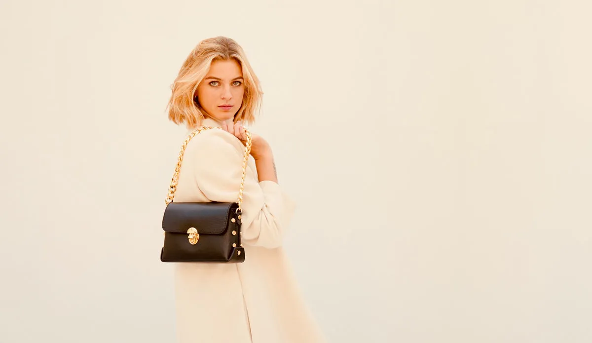 The Bloxsome Black Leather Crossbody Bag With Gold Chain Strap